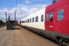 DSB IR4 trainset photographed in Vojens 22. May 2004.  The IR4 was built by ABB Scandia in Denmark. Each unit consists of 3 coaches. Built in a number of 44 trainsets. The trainsets were put in service in 1989 - 1998. 4 electric engines of 420 kW per trainset. Max speed 180 km/h - 112 mph. Length 76 530 mm. Weight 133 metric tonnes. 24/16 seats 1st class, 183/183 + 20 seats 2nd class. Up to 5 trainsets can be put together.